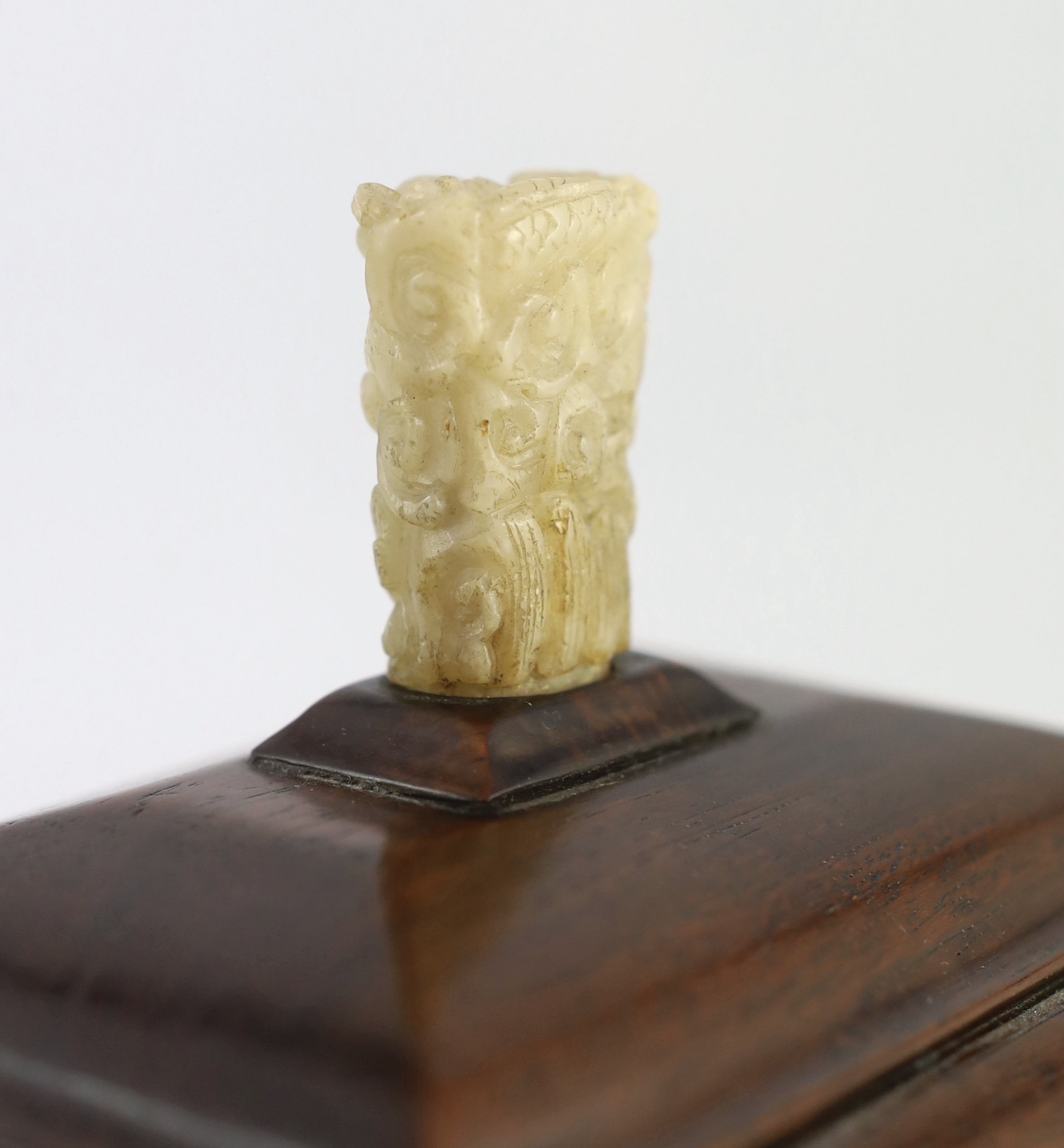 An early 20th century Chinese hongmu stand and cover with a 17th/18th century pale white jade finial